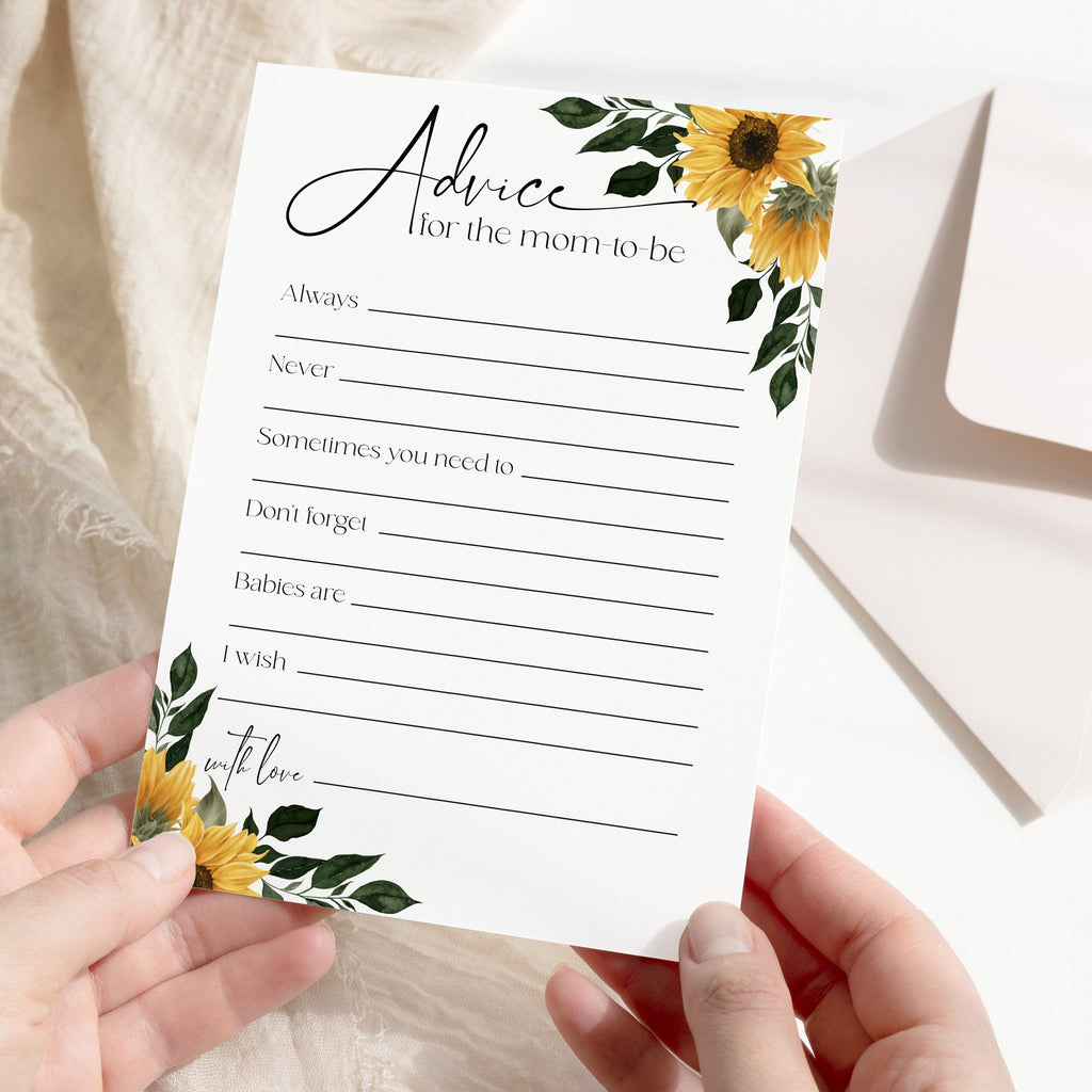A hand holding a greeting card with floral design and advice for new mothers.