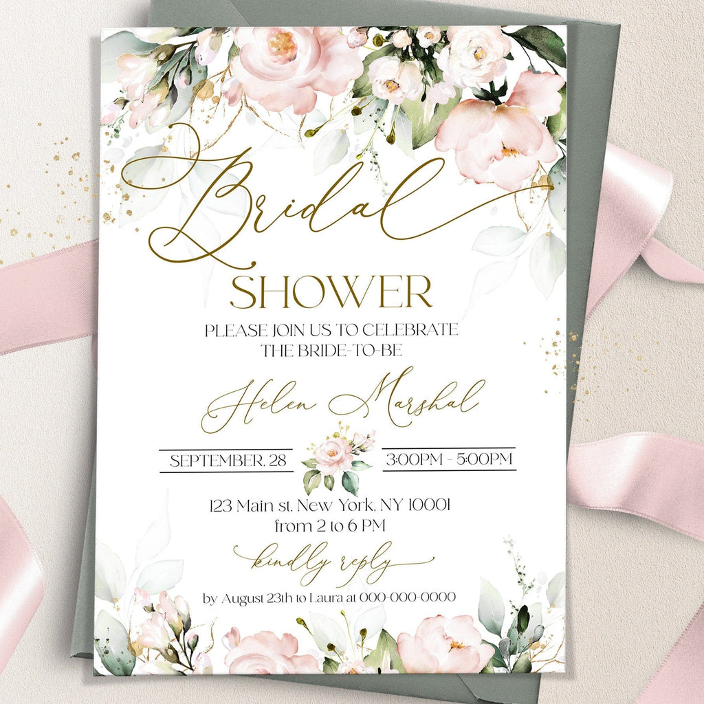 A printed blush pink bridal shower invitation with floral design and gold text, indicating the event details and the bride-to-be's name.