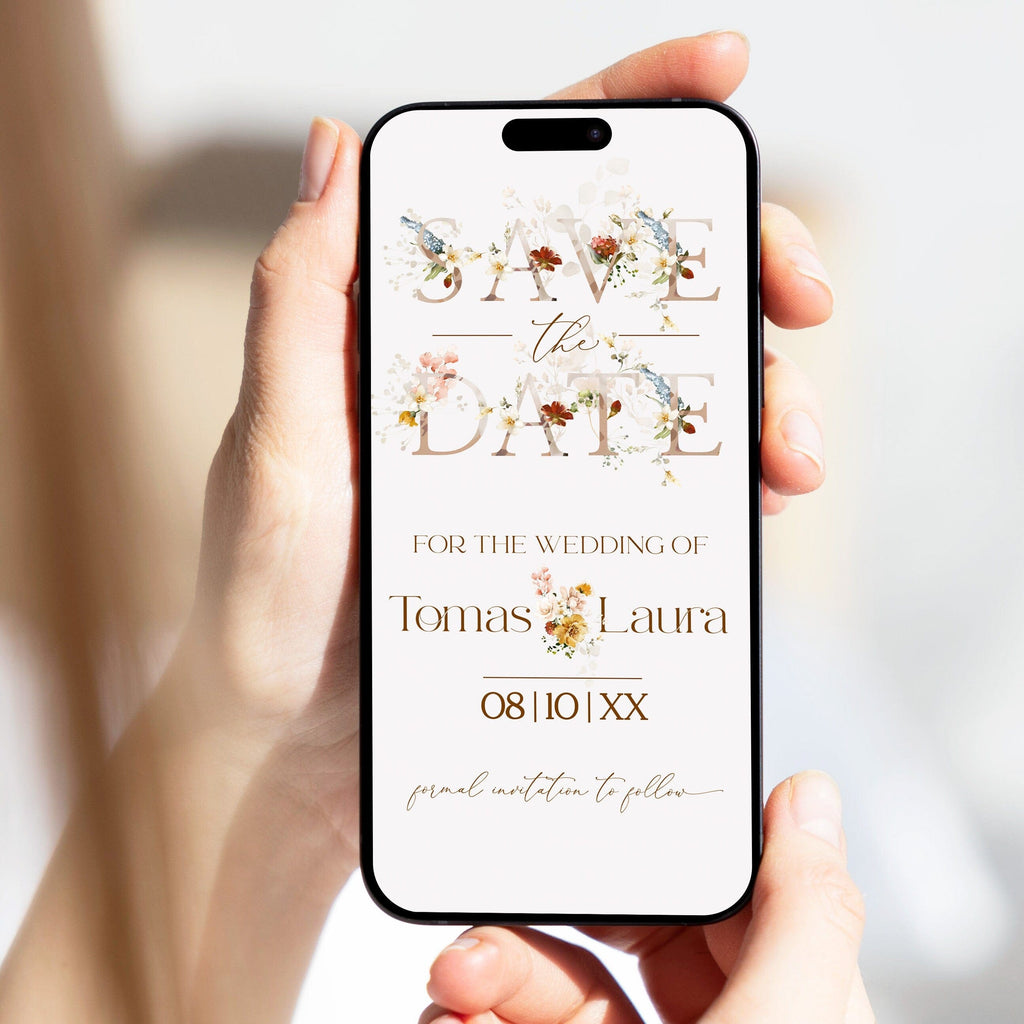 Phone displaying a 'Save the Date' wedding invitation with floral elements.