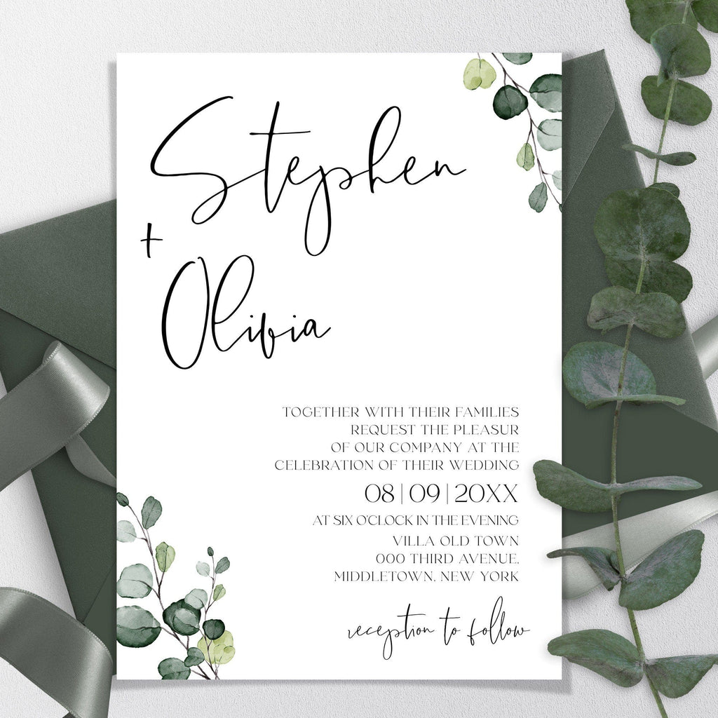 A printed wedding invitation with green eucalyptus leaves and a textual design.