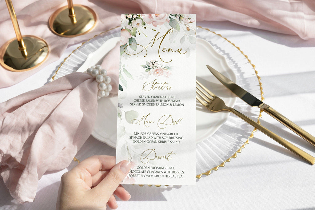 A blush pink menu card with floral print design, held by a hand, with a dinner fork and knife on a white plate in the background, and pearls of wisdom on a pink textured surface.