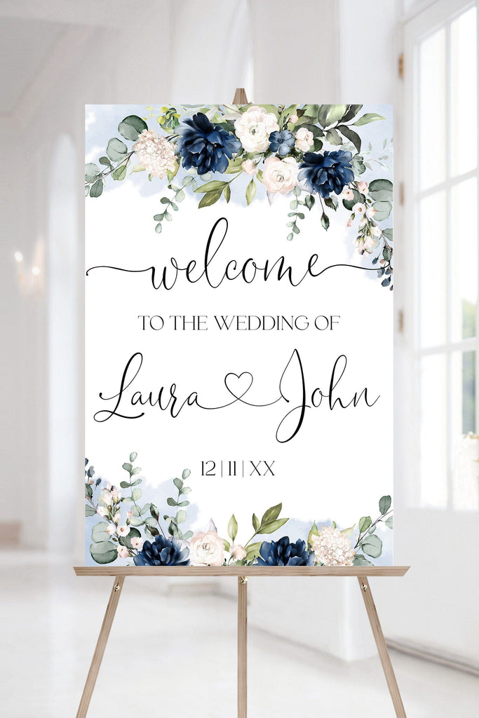 A navy blue and white floral printable wedding welcome poster with the elegant calligraphic fonts.