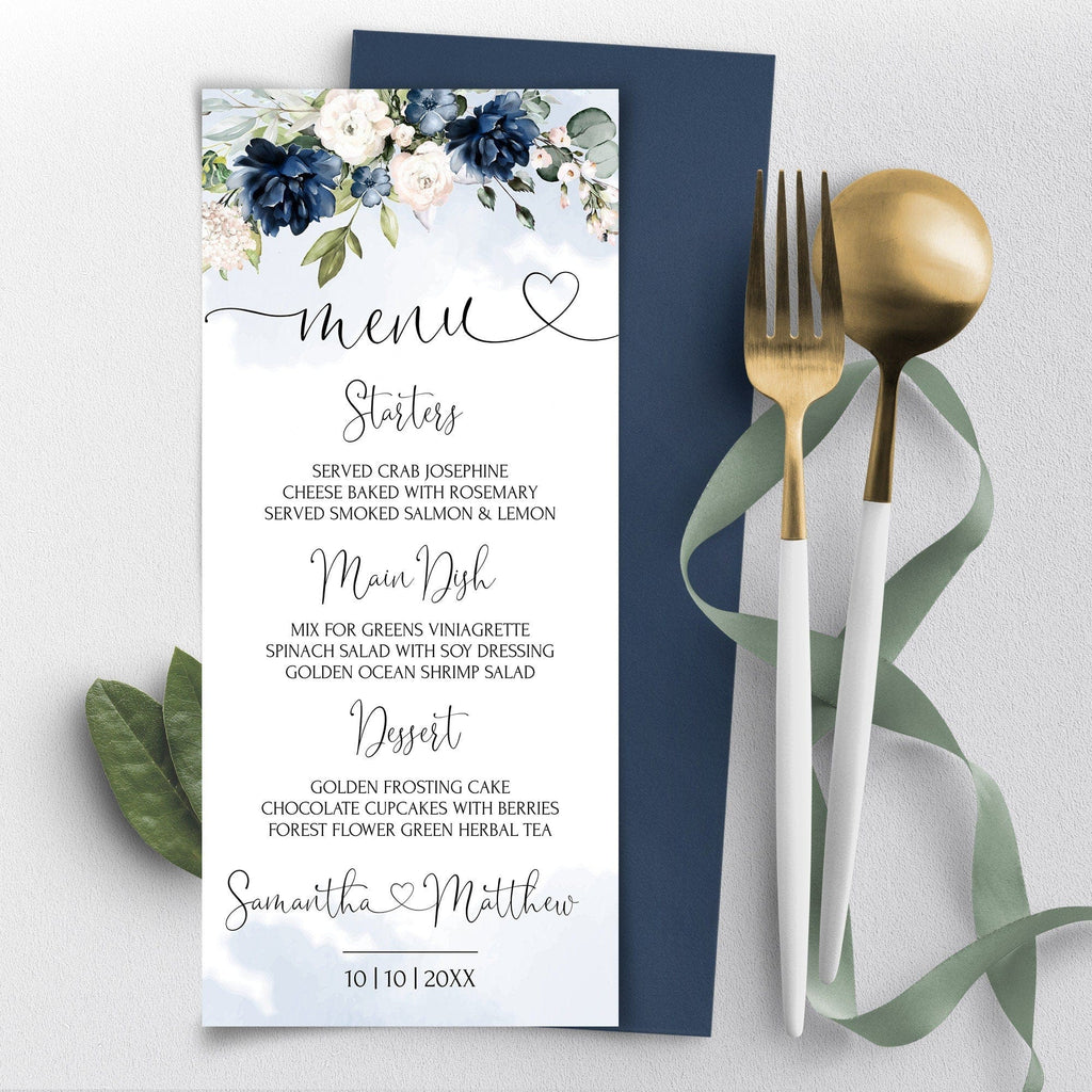 Wedding menu card with floral design, gold fork, and spoon on a light gray background