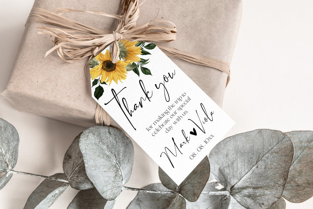 A favor tag with a sunflower design, attached to a burlap-wrapped gift, with a personalized message that reads 'Thank you for watering my garden'.