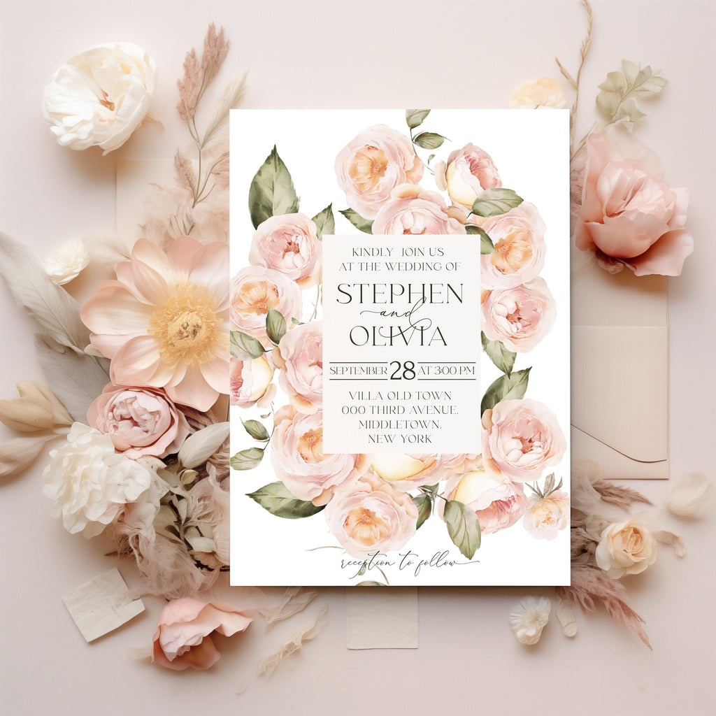 Floral wedding invitation card with pink roses on a light background