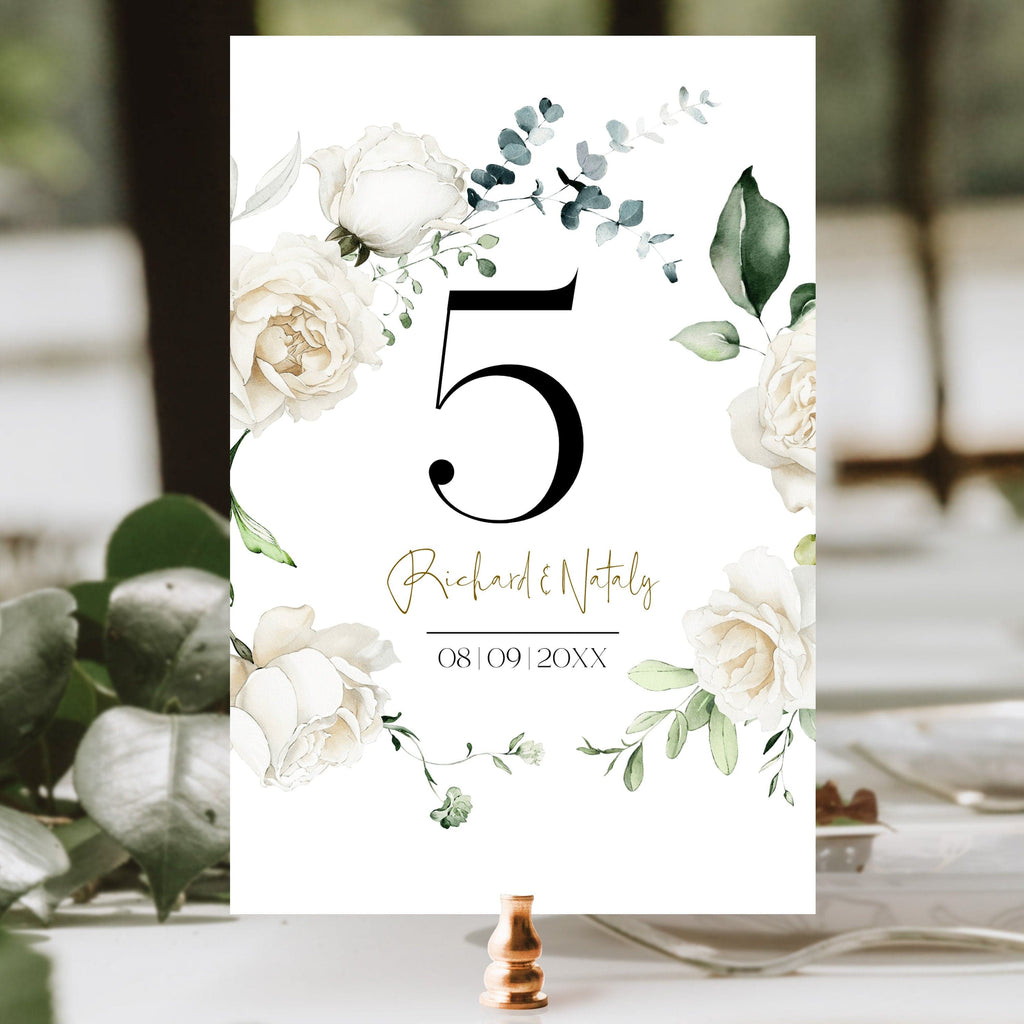 A printable table number with a floral design, featuring the number 5, in a font that resembles a handwritten style. The background is a soft gradient of green and blue, and the text includes the word 'RICHARDNUTT' and '09.