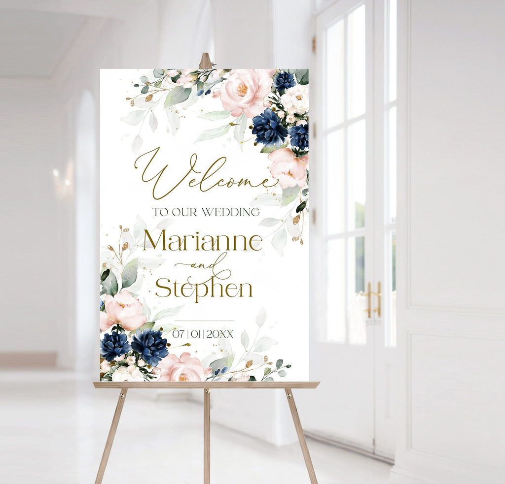 A navy blue and pink floral welcome sign template displayed in a room, with the text 'Welcome to our Wedding' and the names 'Marianne and Stephen'.