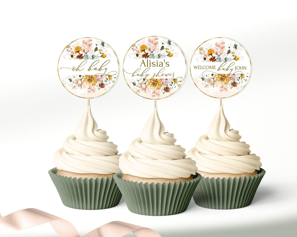 Cupcake toppers with yellow floral design, intended for baby shower celebrations, displayed on a cupcake with white frosting.